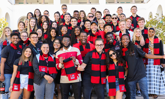 Group of students in I AM SDSU scarves