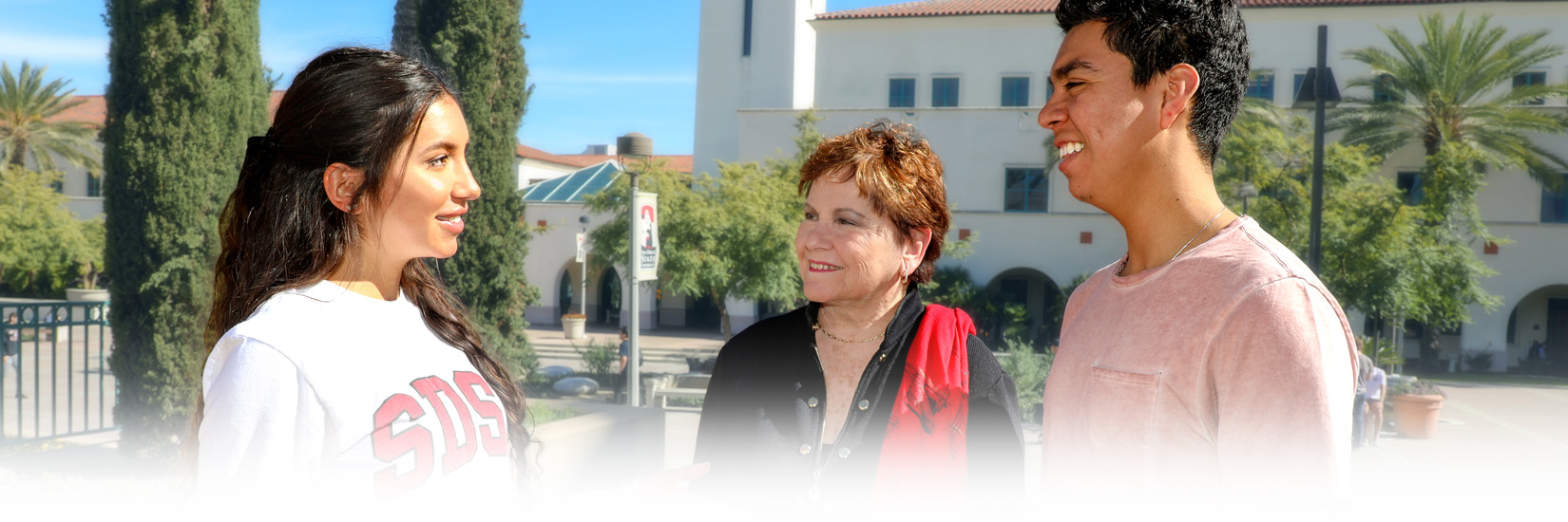 Patti Roscoe with two students