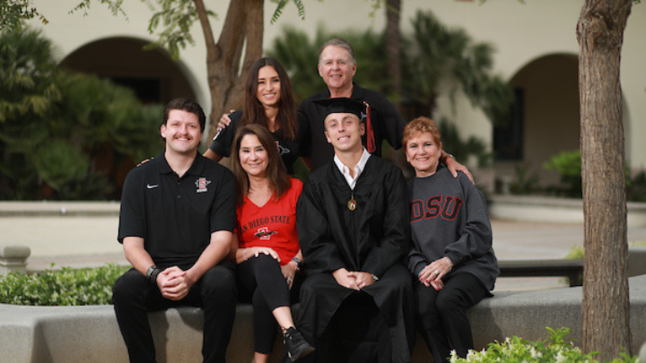 A family posing after graduation