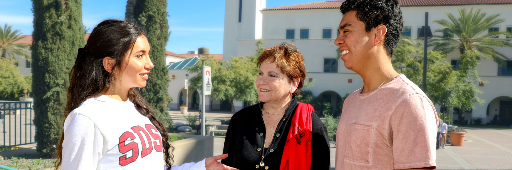 Patti Roscoe with two students